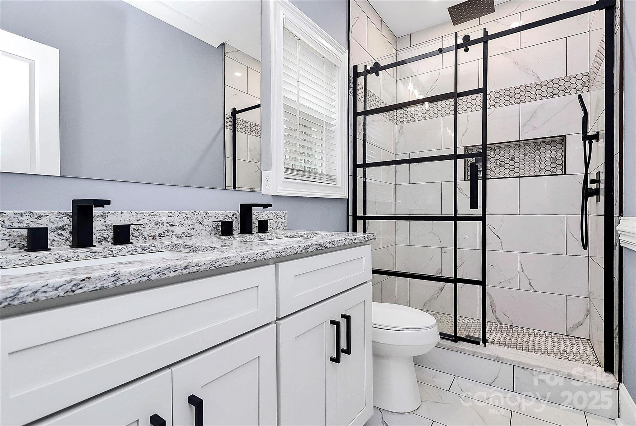 6519 Pargo Road Charlotte, NC 28216 - Photo 23 of 37 a bathroom with a granite countertop sink toilet and shower