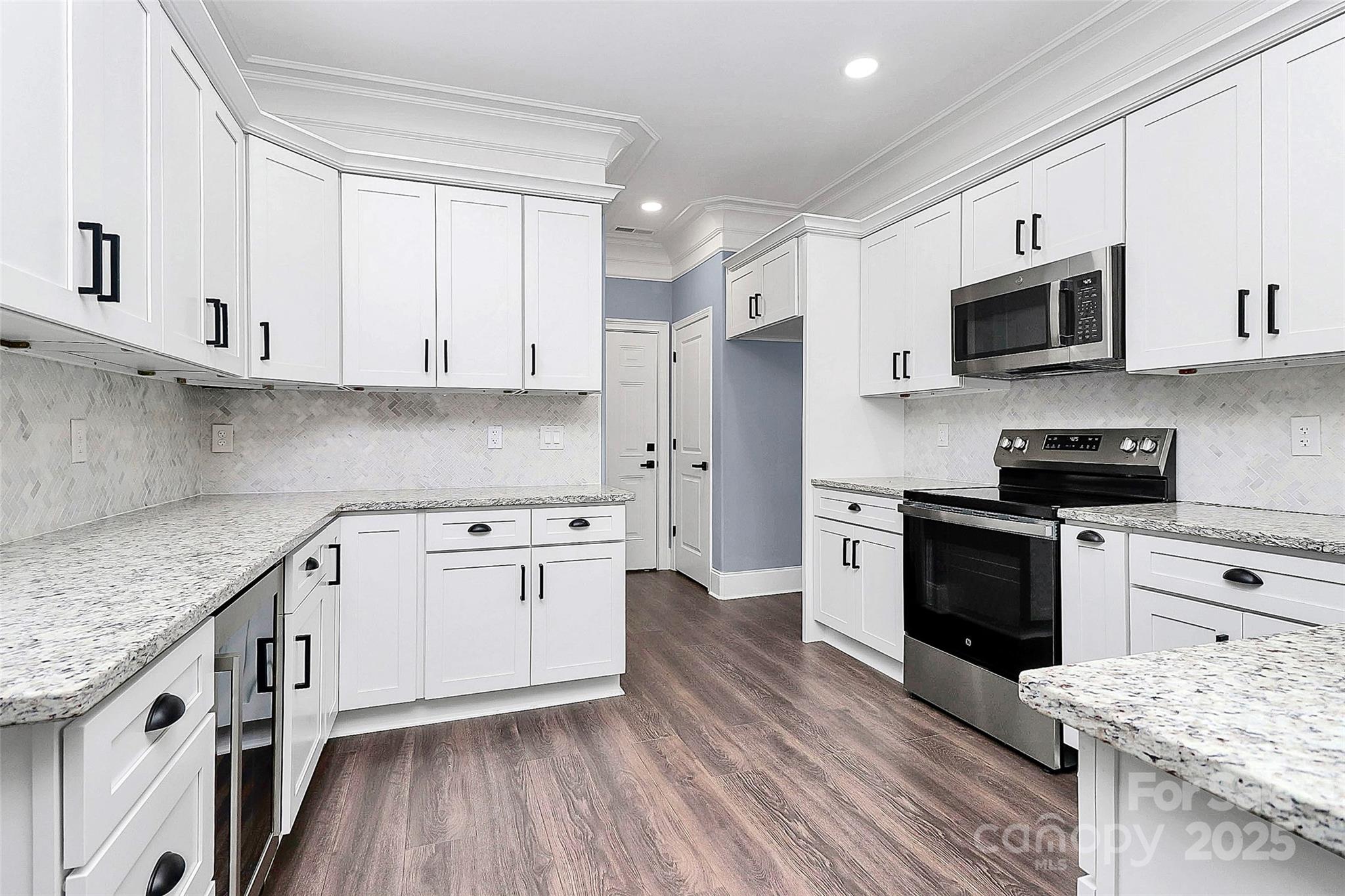 6519 Pargo Road Charlotte, NC 28216 - Photo 28 of 37 a kitchen with stainless steel appliances granite countertop a stove a sink and a refrigerator