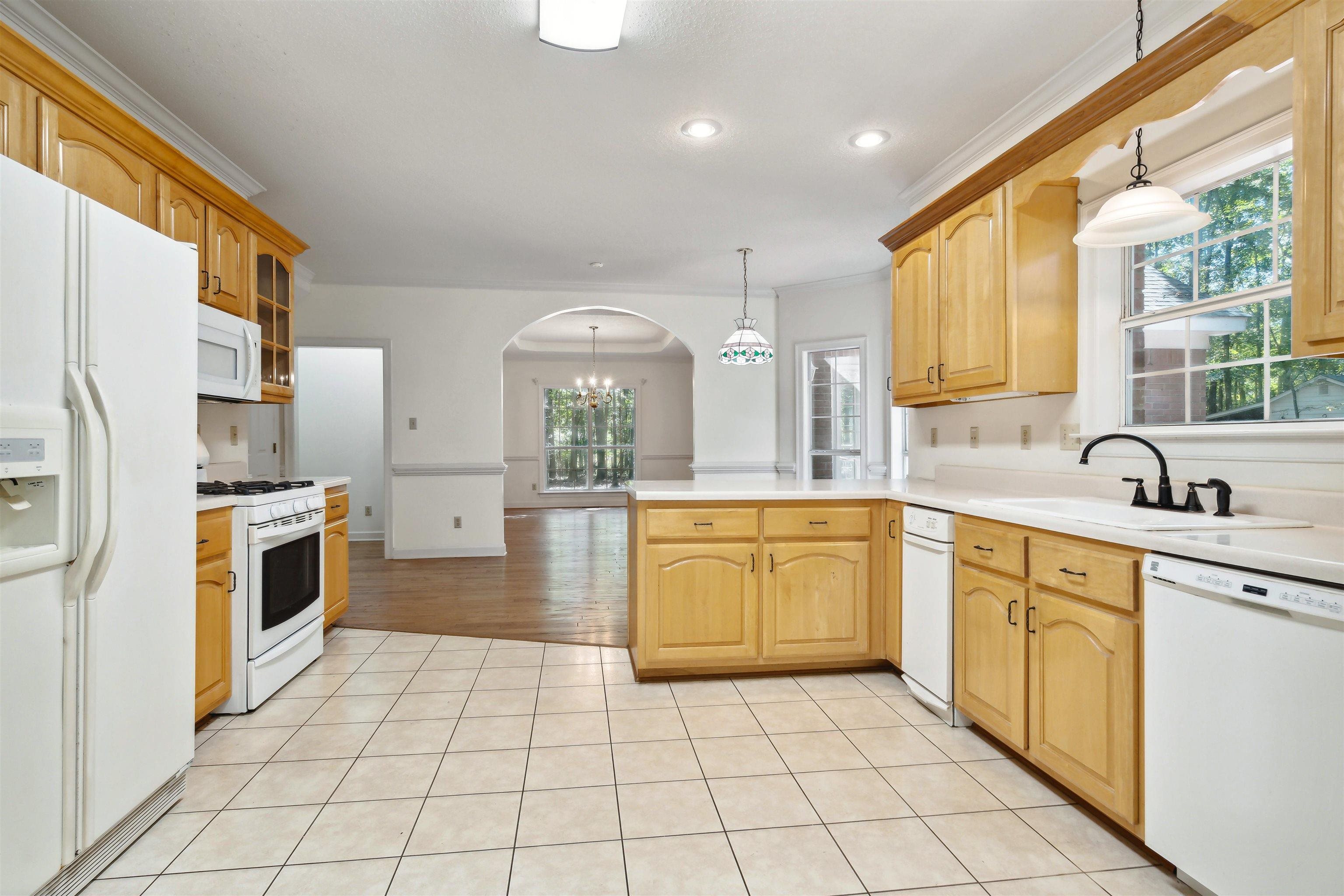 3255 Highway 196 Piperton, TN 38017 - Photo 11 of 22 a kitchen with a sink a stove top oven and cabinets