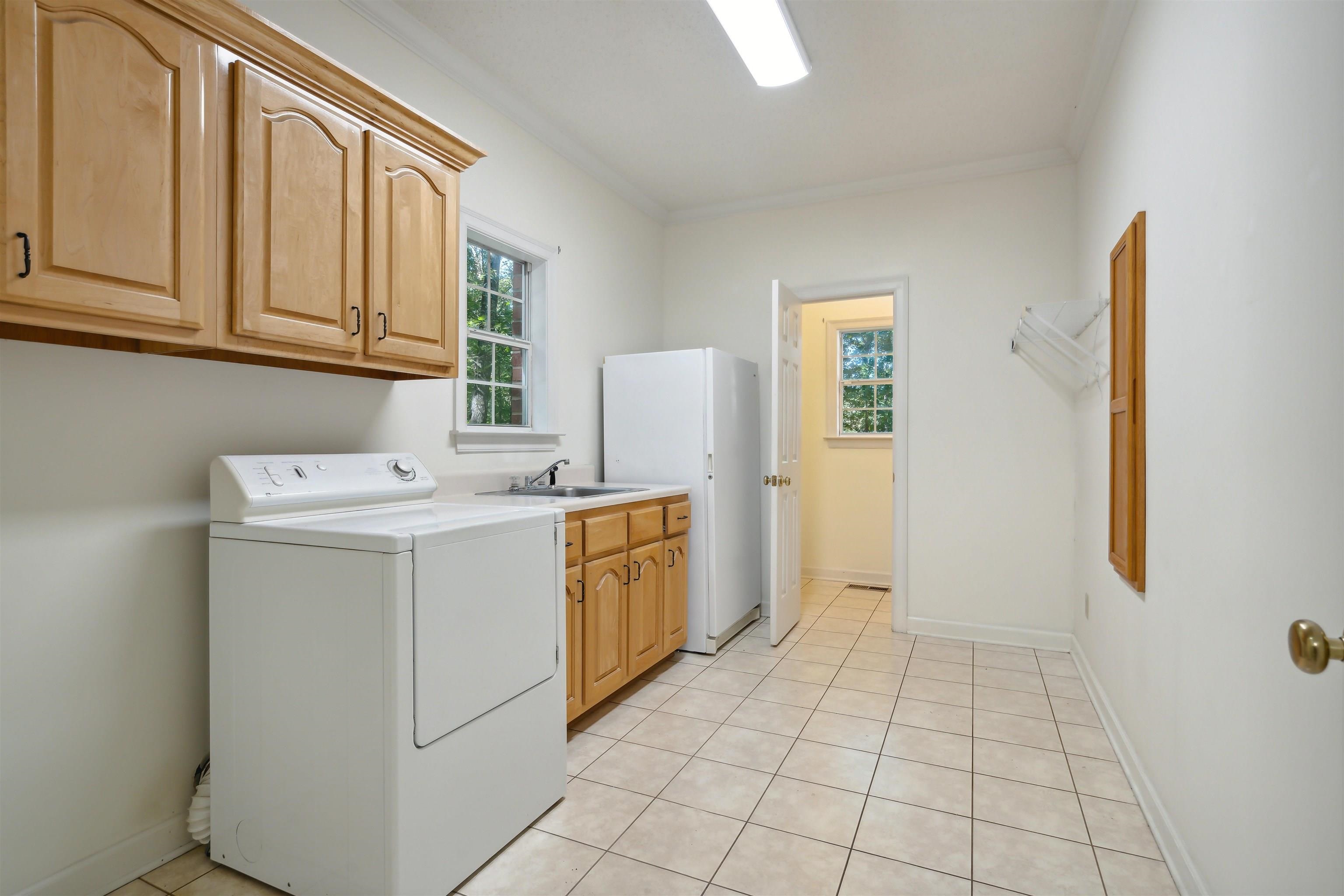 3255 Highway 196 Piperton, TN 38017 - Photo 17 of 22 a utility room with cabinets washer and dryer