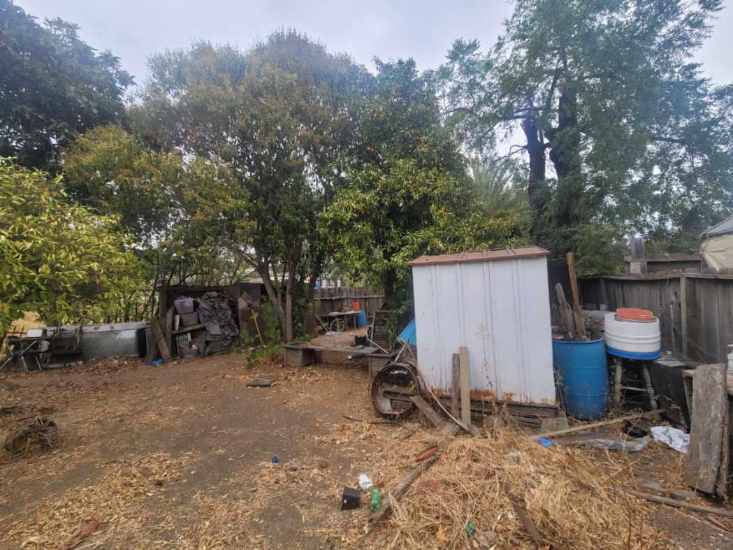 332 Lewis Street, Unit 1/2 Gilroy, CA 95020 - Photo 8 of 18 a view of backyard with a table and a chair