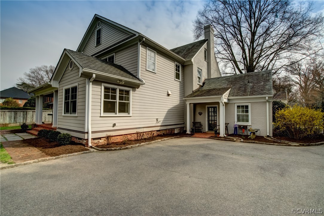 3910 Exeter Road Richmond, VA 23221 - Photo 3 of 39 Side view of home with large paved parking area