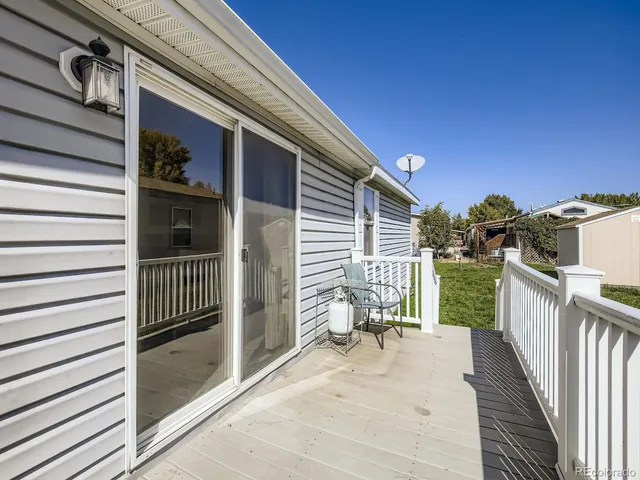 a view of a porch with wooden floor and roof