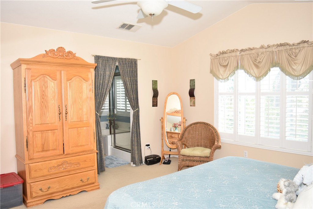 1665 Ravenswood Road Beaumont, CA 92223 - Photo 24 of 41 a bedroom with a bed and a dresser