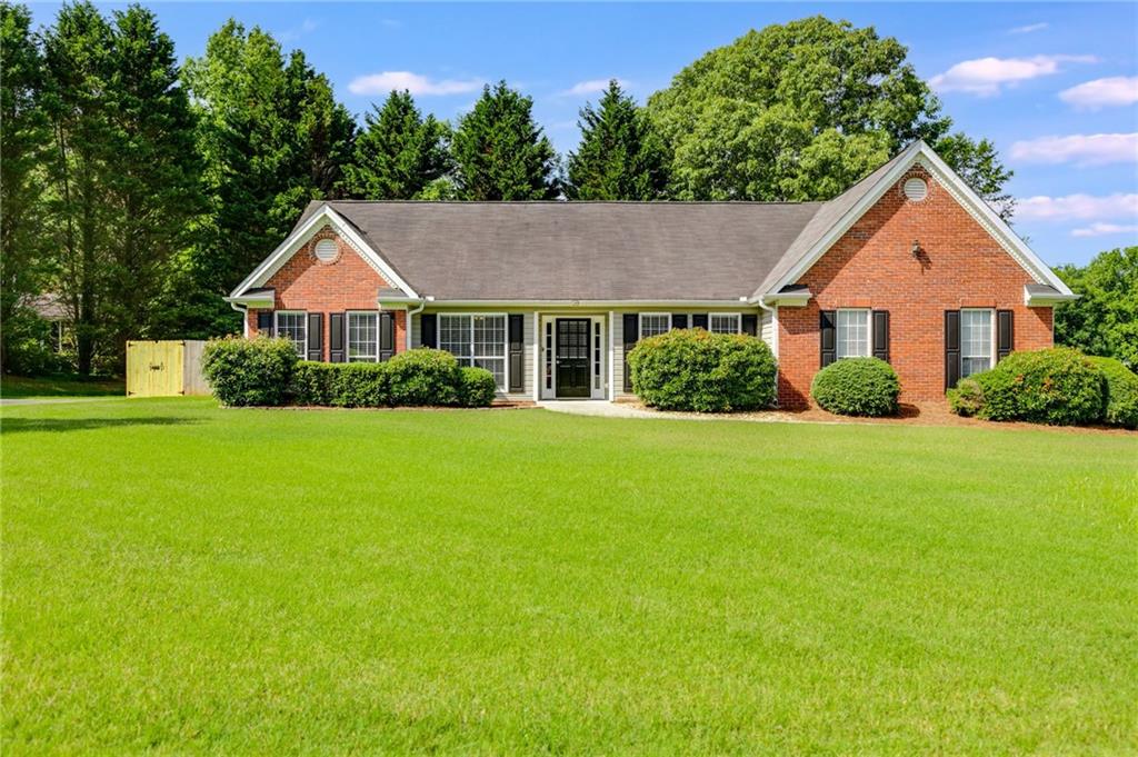 a front view of a house with a yard