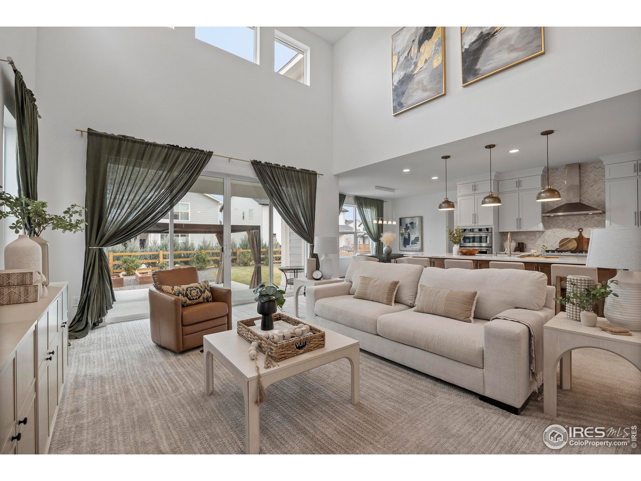 5070 Kidd Street Timnath, CO 80547 - Photo 11 of 42 a living room with furniture and a large window