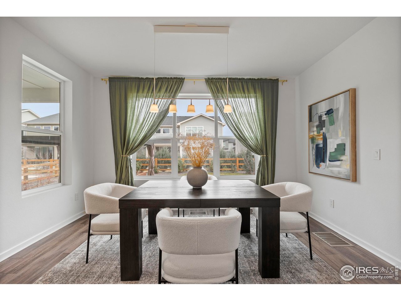5070 Kidd Street Timnath, CO 80547 - Photo 18 of 42 a view of a dining room with furniture and window