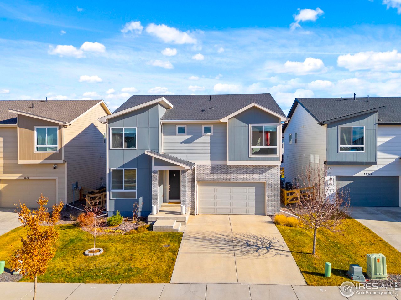 5070 Kidd Street Timnath, CO 80547 - Photo 2 of 42 a front view of a house with yard