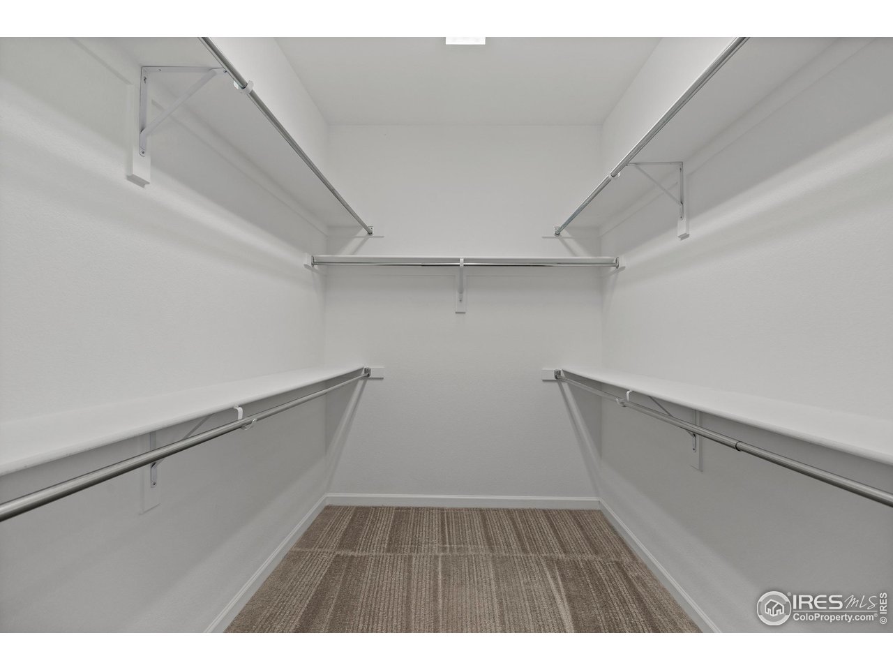 5070 Kidd Street Timnath, CO 80547 - Photo 24 of 42 a view of an empty walk in closet