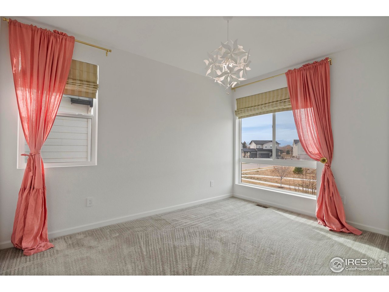 5070 Kidd Street Timnath, CO 80547 - Photo 26 of 42 a view of an empty room with a window