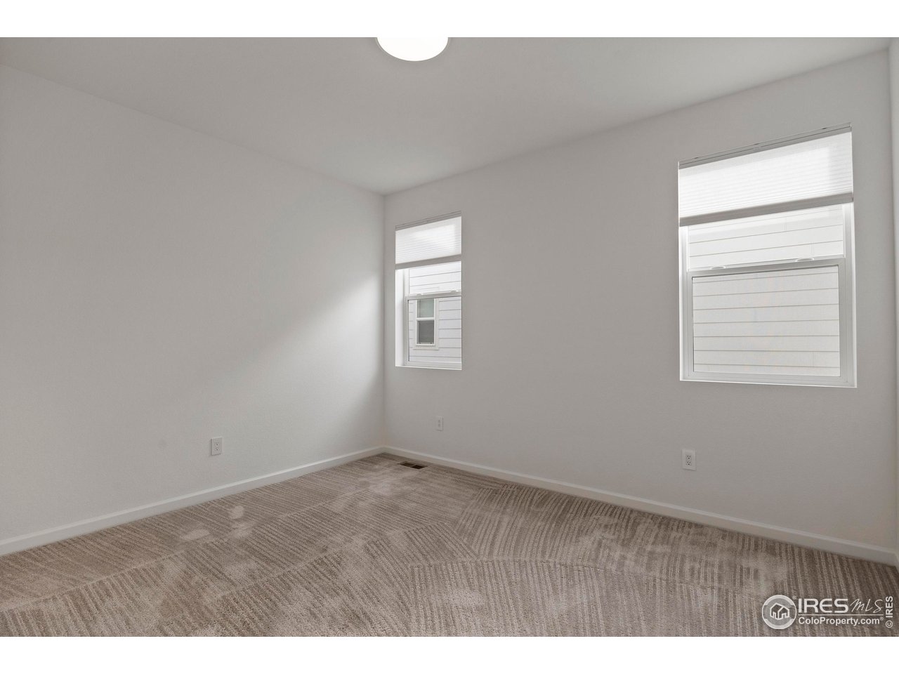 5070 Kidd Street Timnath, CO 80547 - Photo 27 of 42 a view of an empty room with a window