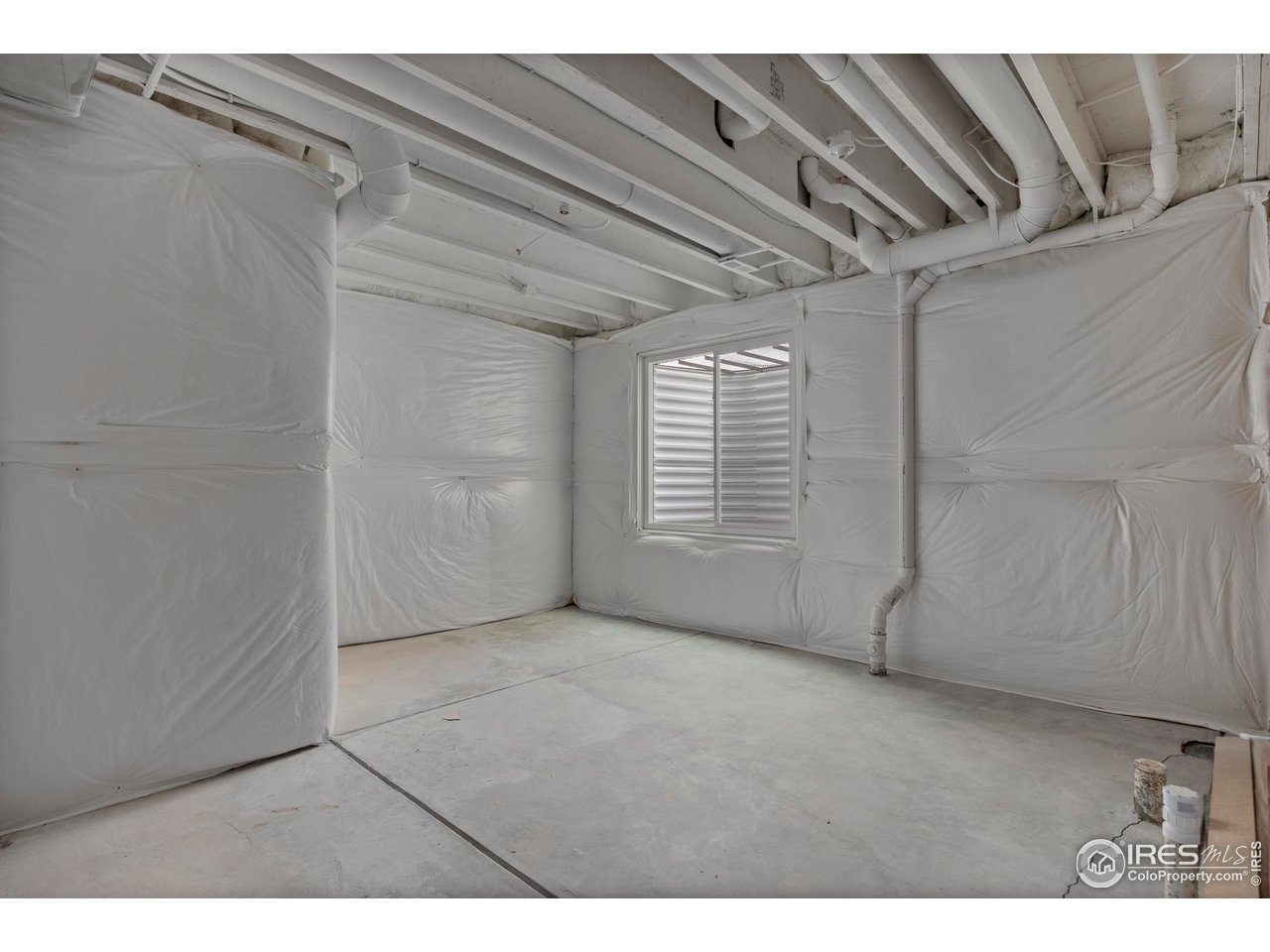 5070 Kidd Street Timnath, CO 80547 - Photo 30 of 42 a view of an empty room with a window