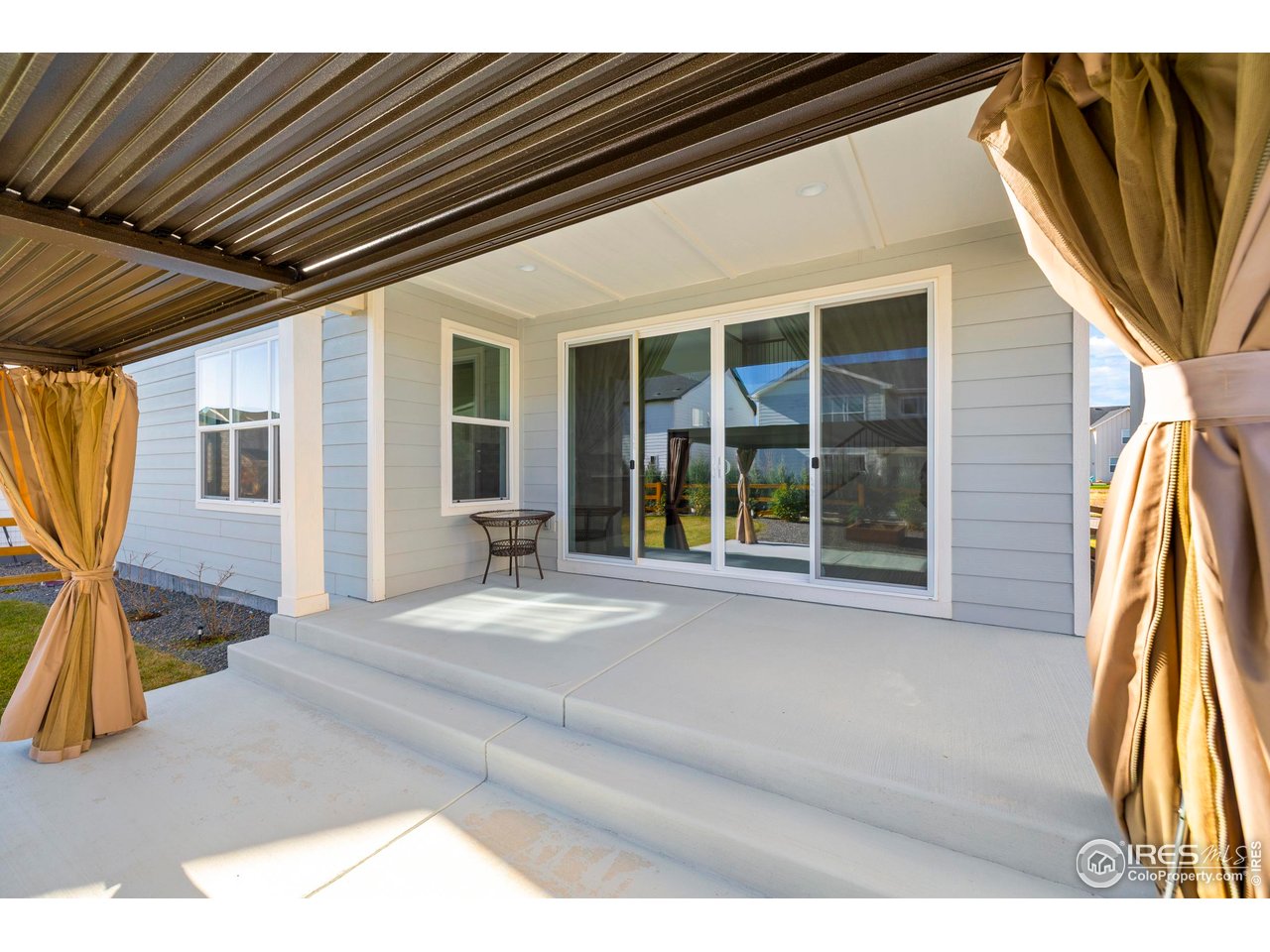 5070 Kidd Street Timnath, CO 80547 - Photo 32 of 42 a view of a house with a backyard