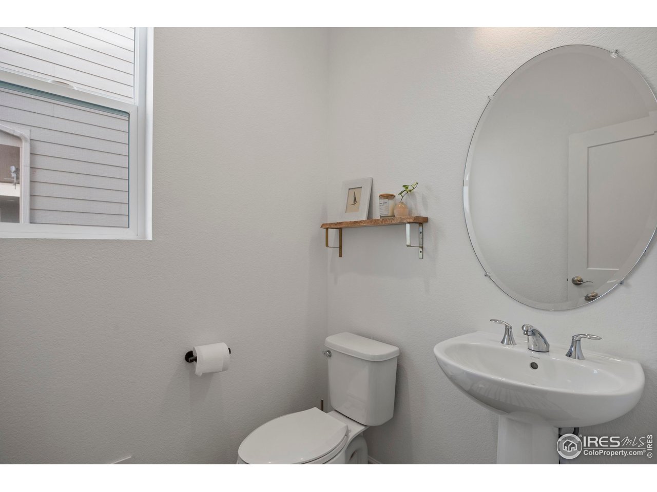 5070 Kidd Street Timnath, CO 80547 - Photo 8 of 42 a bathroom with a sink and mirror
