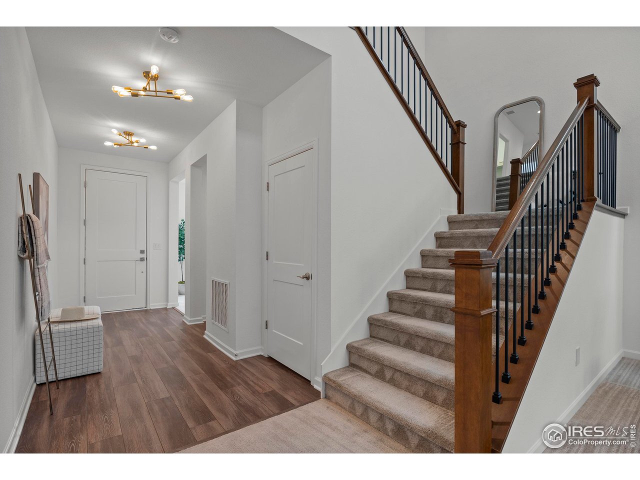 5070 Kidd Street Timnath, CO 80547 - Photo 9 of 42 a view interior of a house with wooden floor and stairs