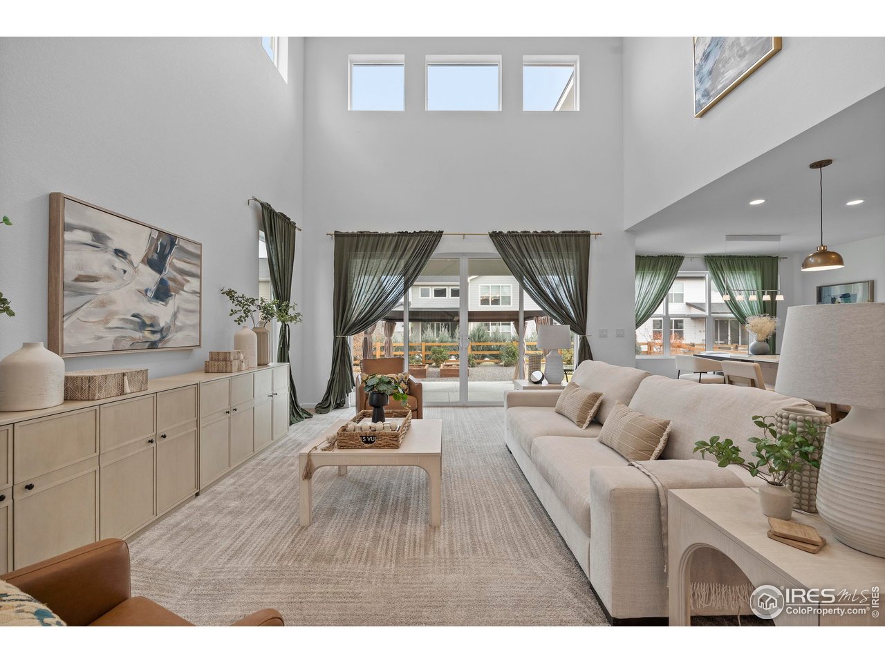 5070 Kidd Street Timnath, CO 80547 - Photo 10 of 42 a living room with furniture and wooden floor