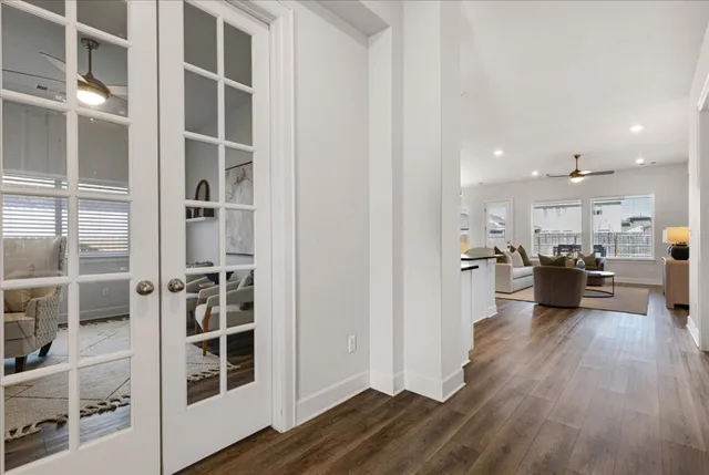 a view of a living room kitchen and windows