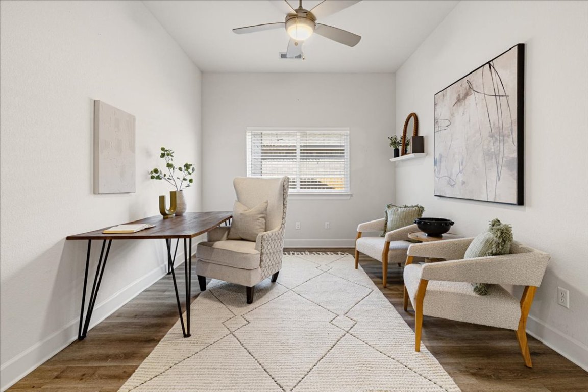 908 Knowles Drive Hutto, TX 78634 - Photo 12 of 37 a living room with furniture and a window