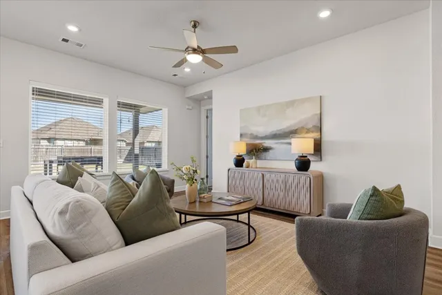 a living room with furniture and a large window