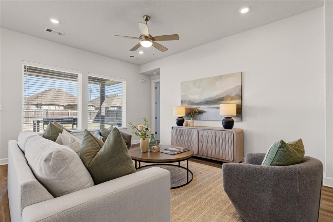 908 Knowles Drive Hutto, TX 78634 - Photo 13 of 37 a living room with furniture and a large window