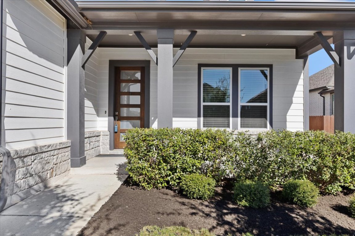 908 Knowles Drive Hutto, TX 78634 - Photo 2 of 37 a view of a house with a garden