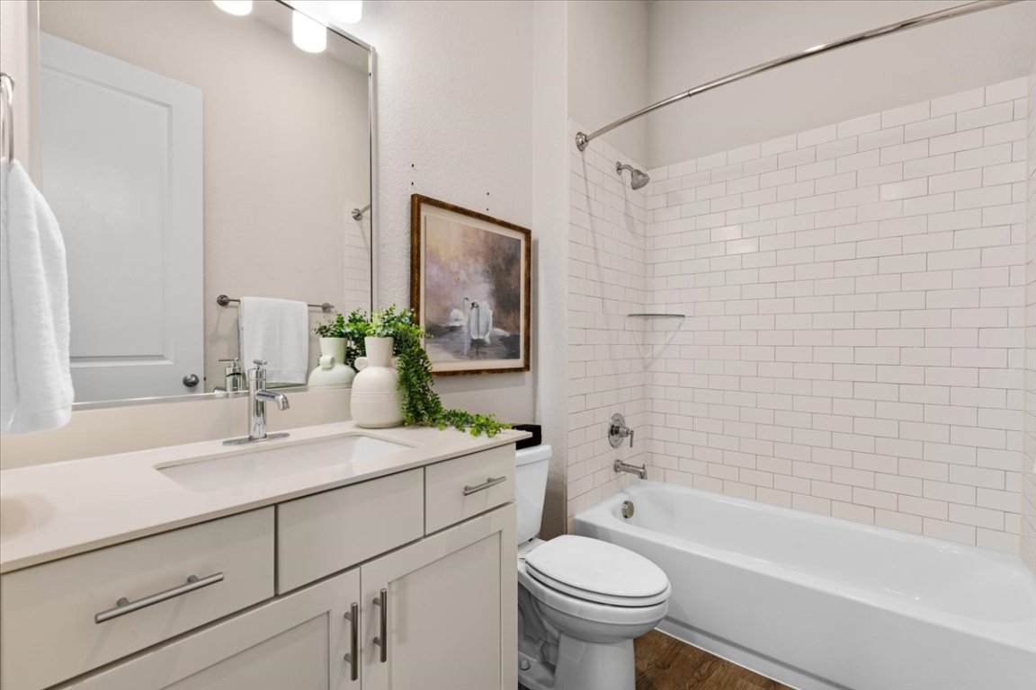 908 Knowles Drive Hutto, TX 78634 - Photo 21 of 37 a bathroom with a sink toilet and shower