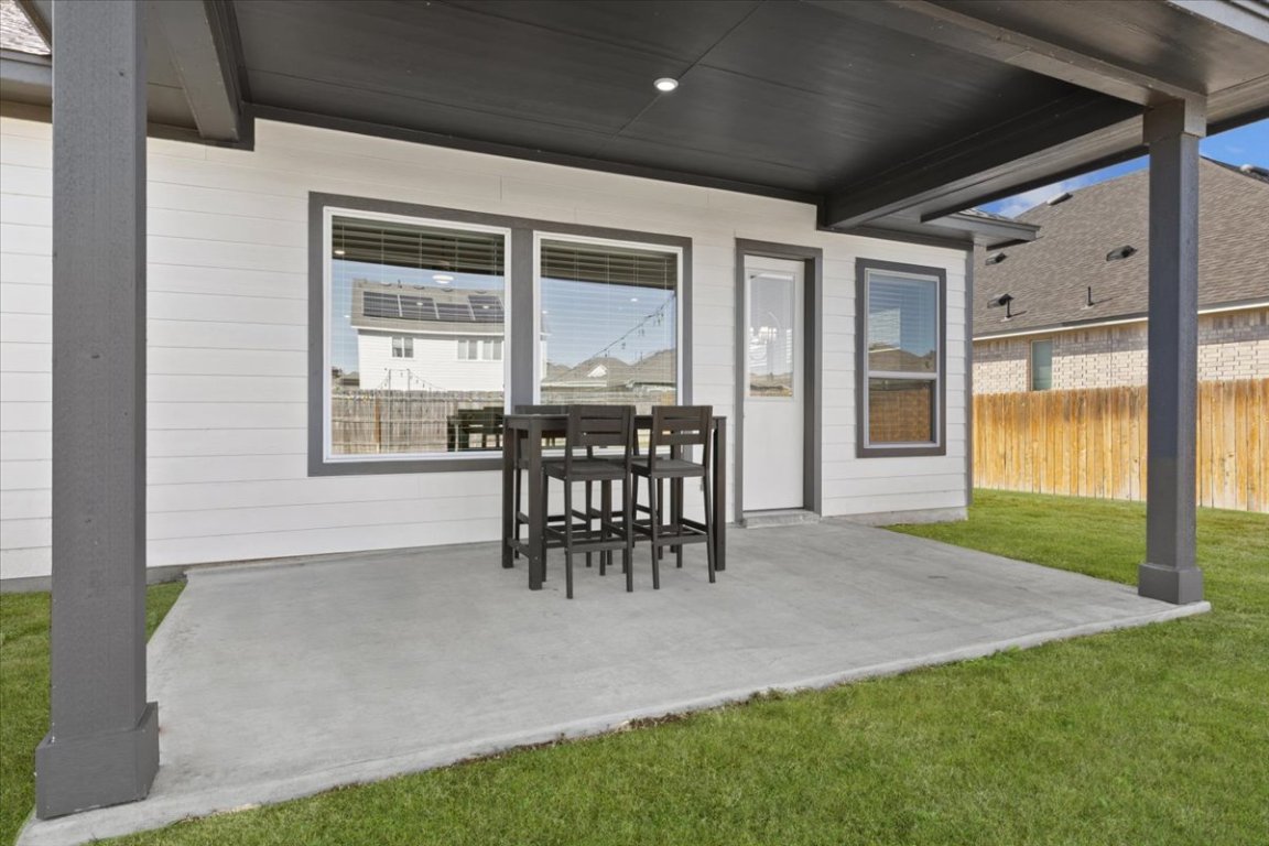 908 Knowles Drive Hutto, TX 78634 - Photo 24 of 37 a patio with table and chairs