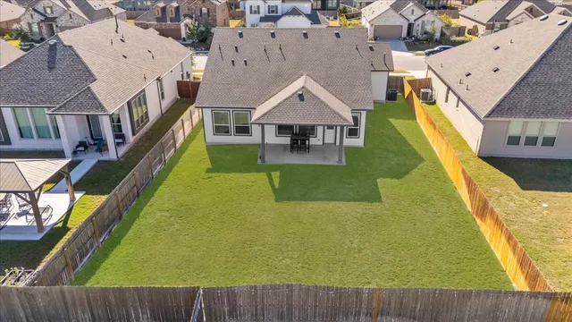 an aerial view of a house with swimming pool