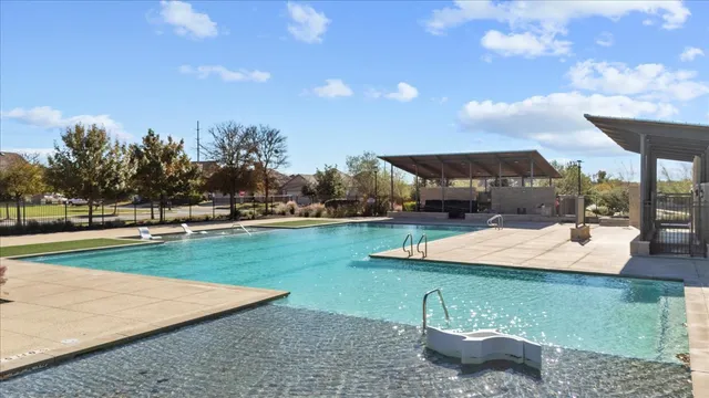 a view of a garden with lawn chairs