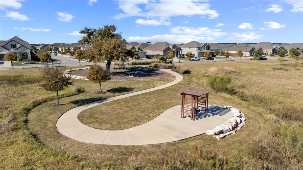 908 Knowles Drive Hutto, TX 78634 - Photo 35 of 37 a view of a swimming pool with outdoor seating