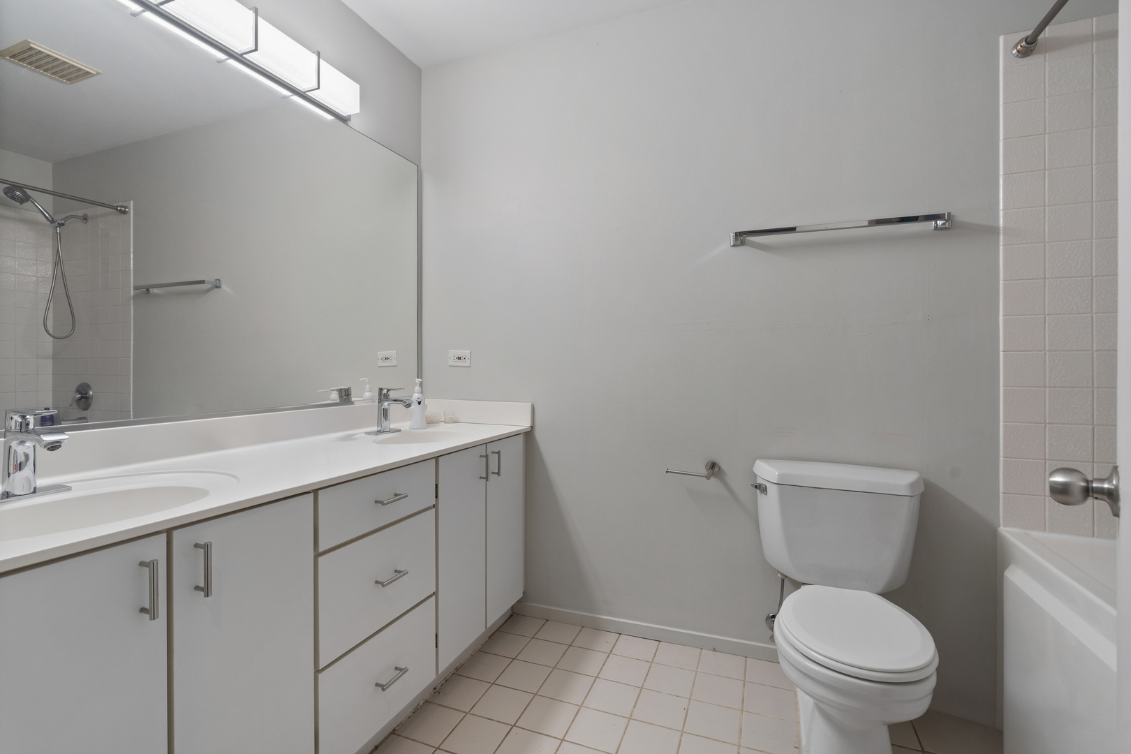 811 South Lytle Street, Unit 207 Chicago, IL 60607 - Photo 8 of 12 a bathroom with a toilet sink and mirror