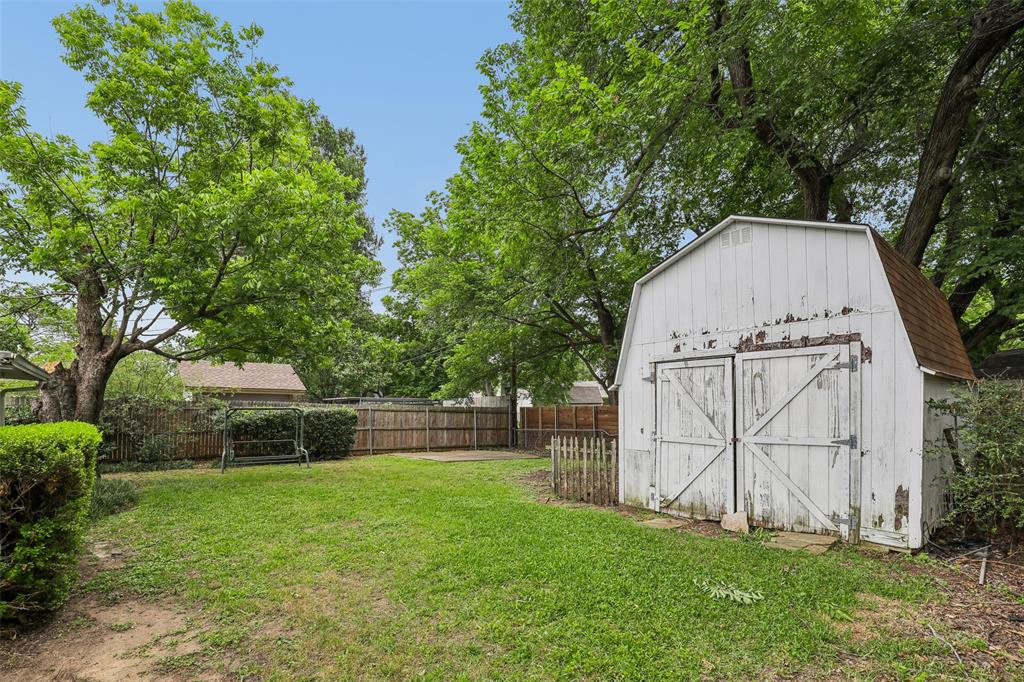 1810 Ridgewood Street Irving, TX 75062 - Photo 18 of 19 Large shed and a cement platform for a picnic area or new shed.