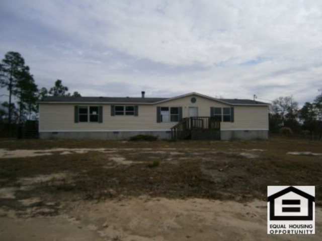 2570 Jackson Road Roberta, GA 31078 - Photo 1 of 1 a house view with a backyard space