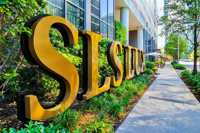 a view of a patio with couches and potted plants