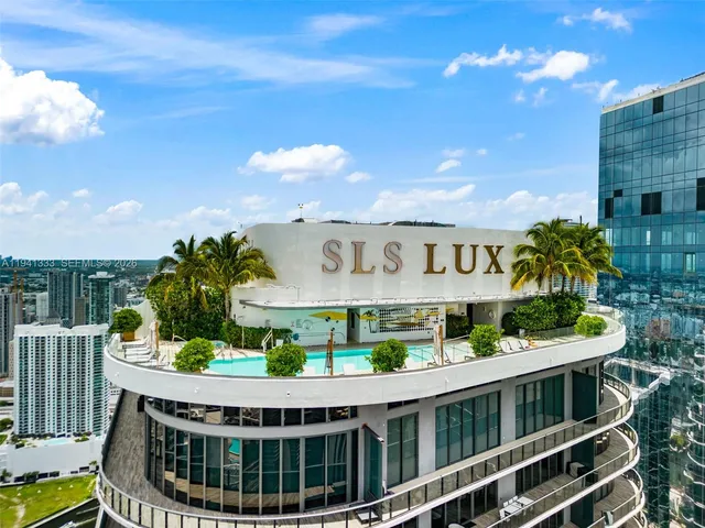 a view of room with workspace and windows