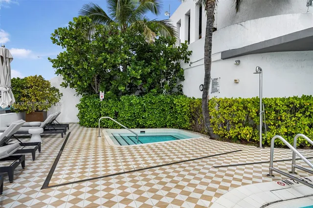 a view of roof deck with building and city view