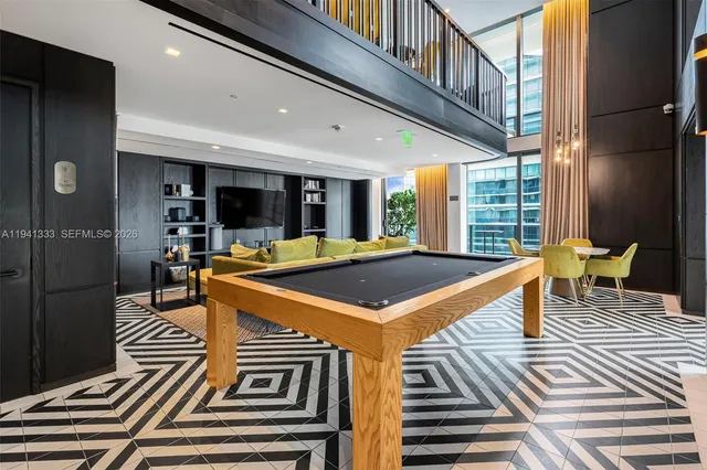 a view of building with garden space and seating area