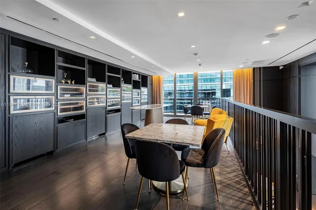 a room with lots of furniture and windows