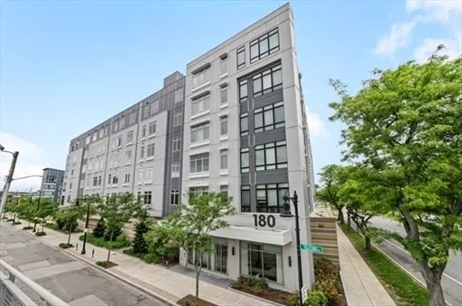 a view of a tall building in the backyard