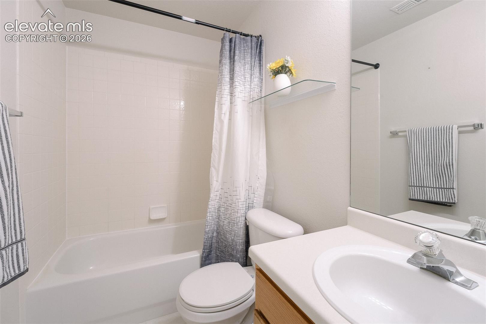 7869 Fort Smith Road Peyton, CO 80831 - Photo 35 of 50 The Basement Bathroom features a vanity, mirror, and tiled tub/shower.