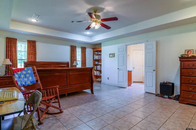 a bedroom with furniture and window