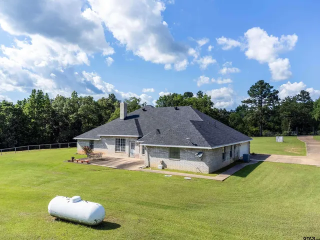 a view of a lake with houses in the back