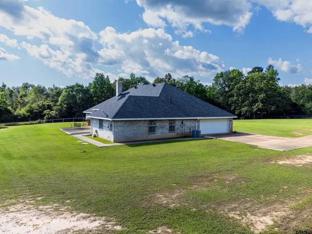 a view of a house with a big yard