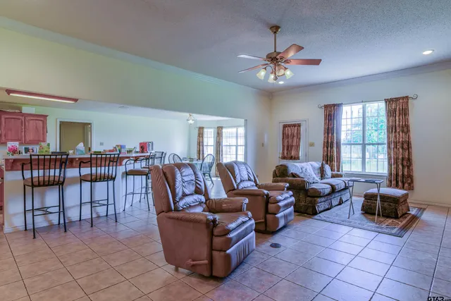 a living room with fireplace furniture and a window