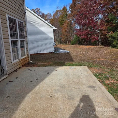 a view of a backyard of the house