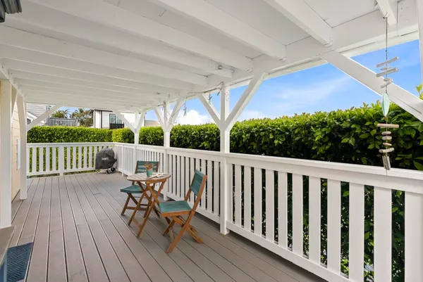 swimming pool view with a seating space