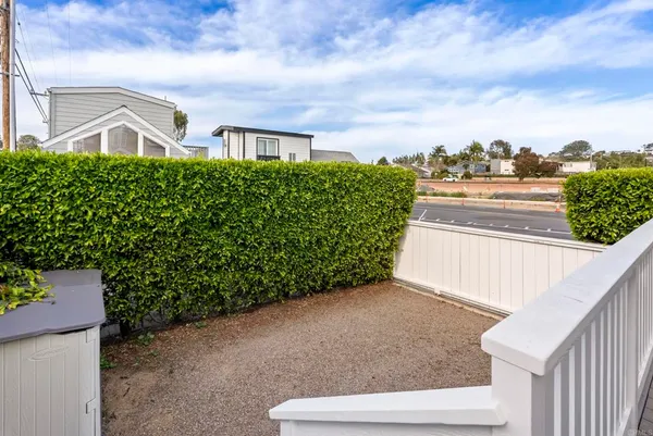 a view of a house with a fence