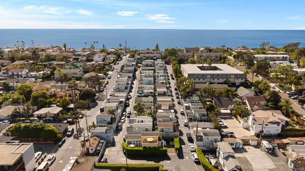 an aerial view of a city with lots of residential buildings