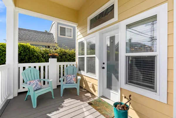 a view of a two chairs in the balcony