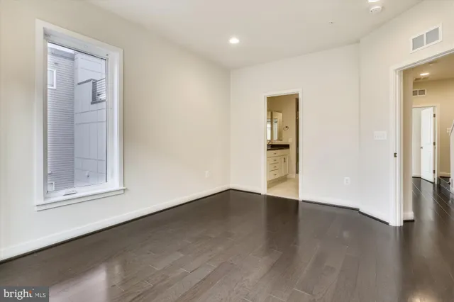 a view of small space with empty racks on the wall